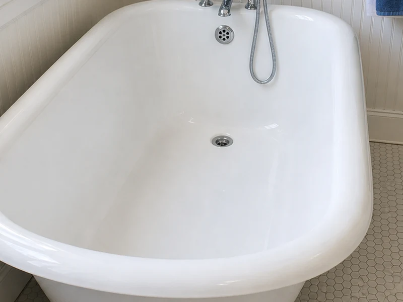 Same clawfoot tub interior refinished to smooth glossy white, original feet untouched, in a Niles home, Fremont