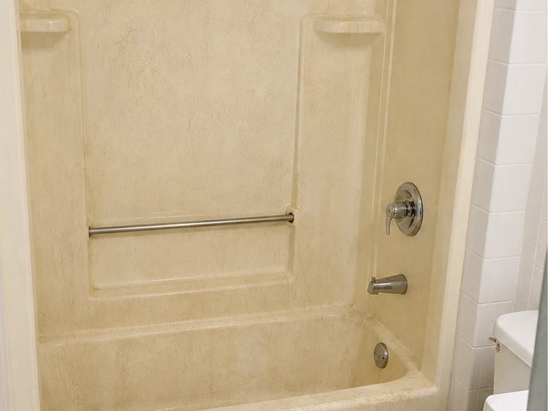 Chalky crazed fiberglass tub-shower combo in a Centerville rental before turnover refinishing, Fremont